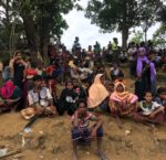 A group of Rohingya refugees, who had recently arrived in the Bangladesh camp of
Kutupalong, waiting for humanitarian assistance, October 2017.